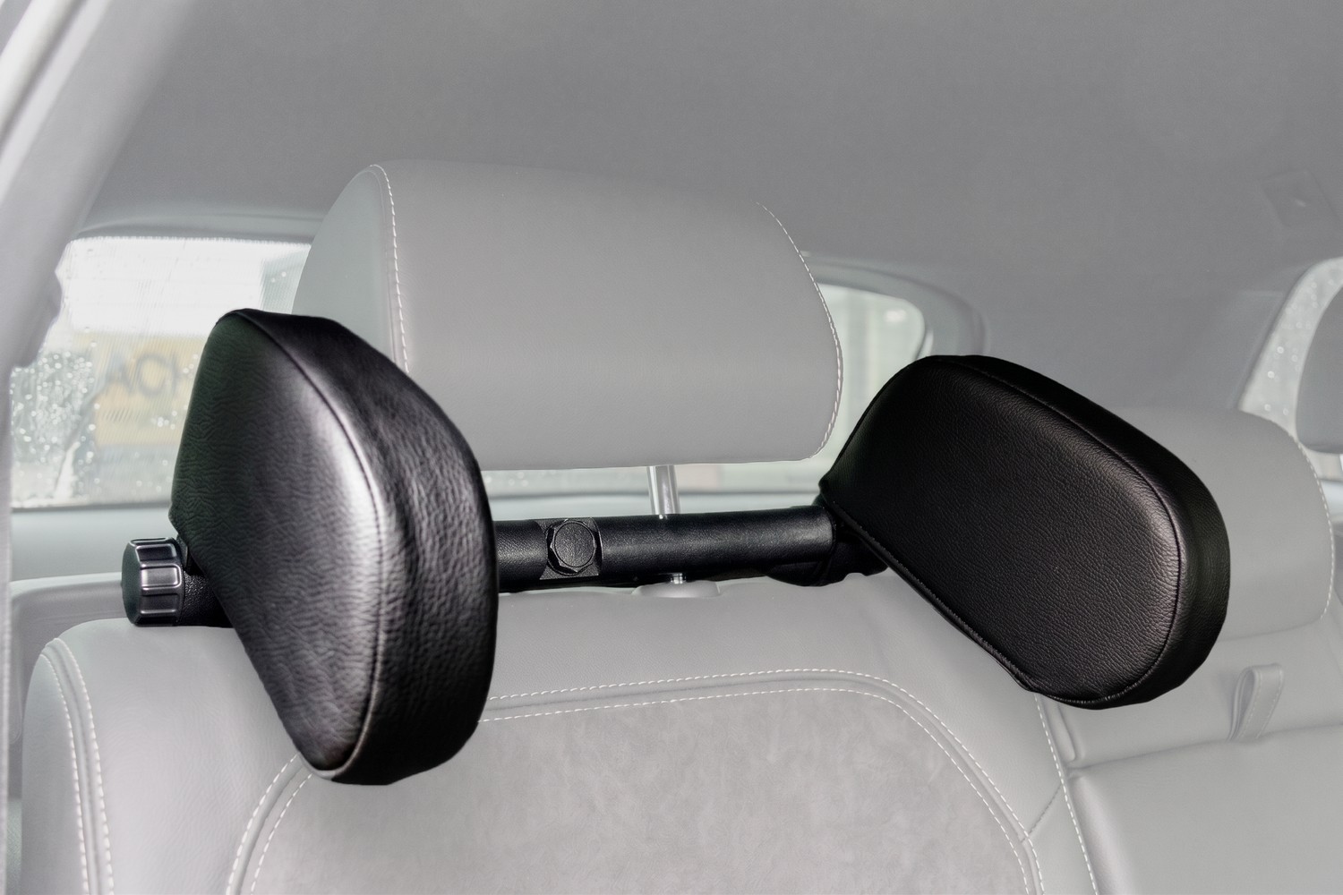 Adjustable travel headrest faux leather